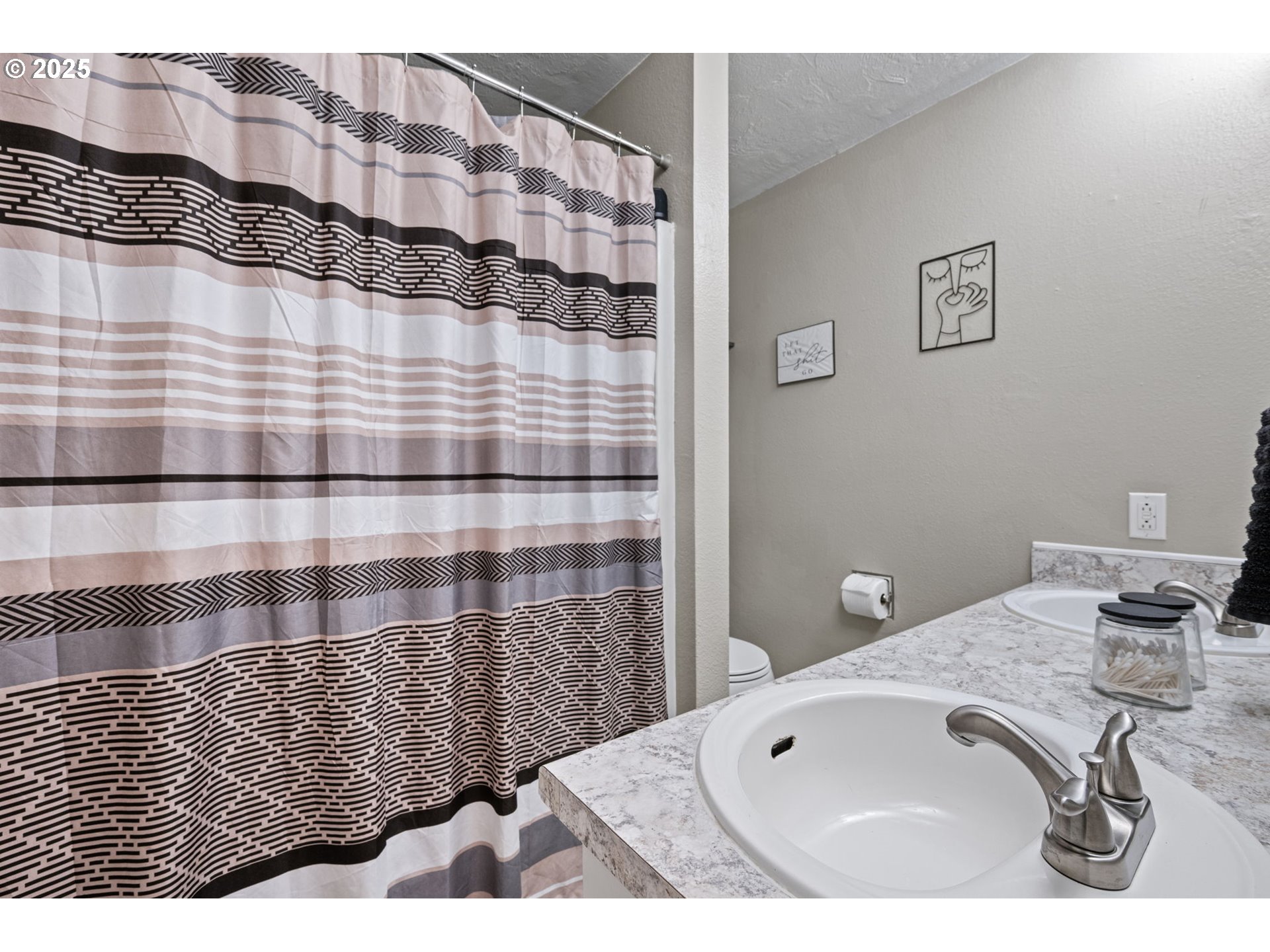 296 65th Street Springfield, OR 97478 - Photo 22 of 33 a bathroom with a sink and a mirror