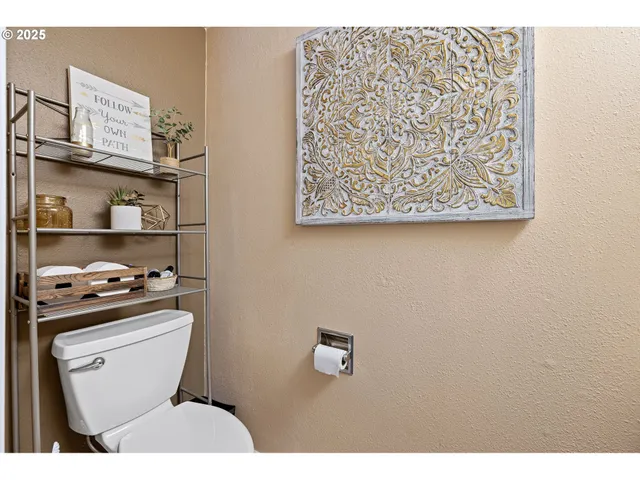 a bathroom with a toilet and a sink