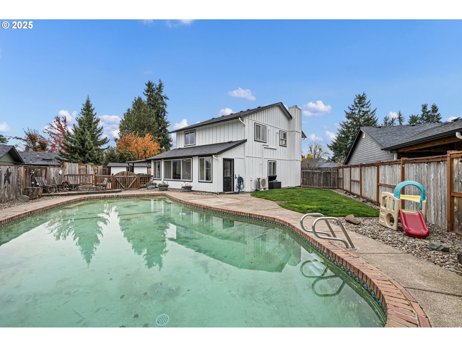296 65th Street Springfield, OR 97478 - Photo 25 of 33 a view of an house with swimming pool and porch