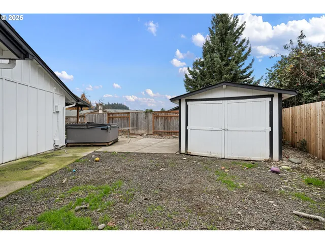 a view of a backyard of the house