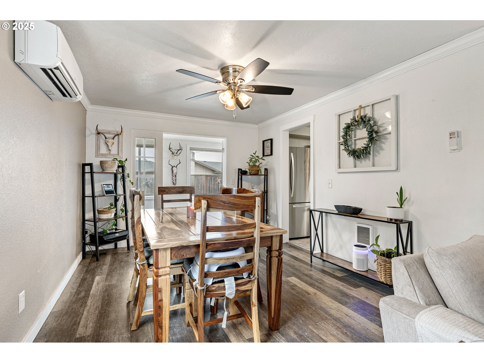 296 65th Street Springfield, OR 97478 - Photo 6 of 33 a view of a dining room with furniture and wooden floor