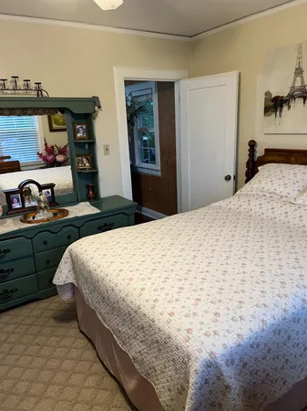 a bedroom with a bed and closet