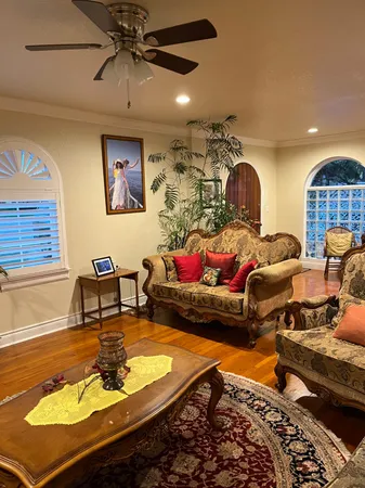 a living room with furniture rug and window