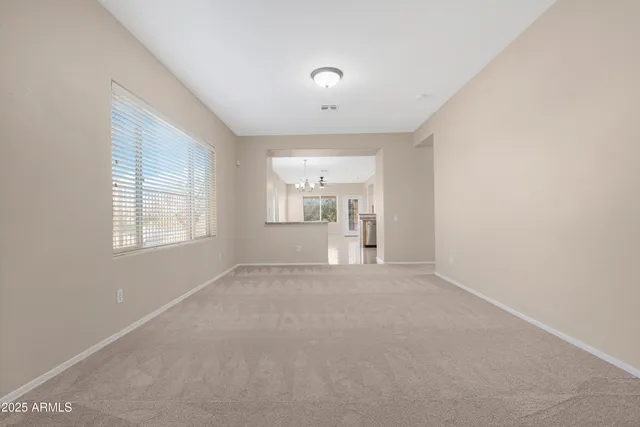 a view of empty room with windows