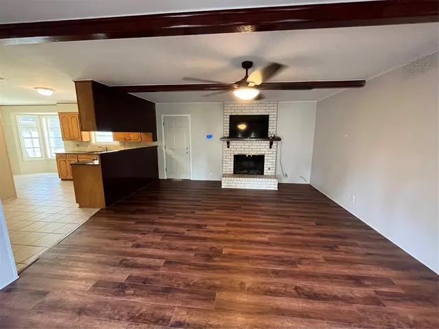 a view of a living room with a flat screen tv