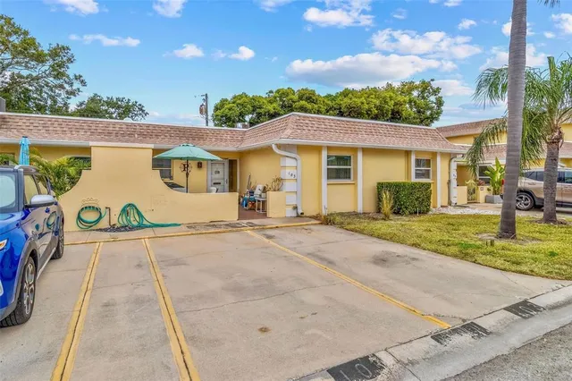 a view of a white house with a outdoor space