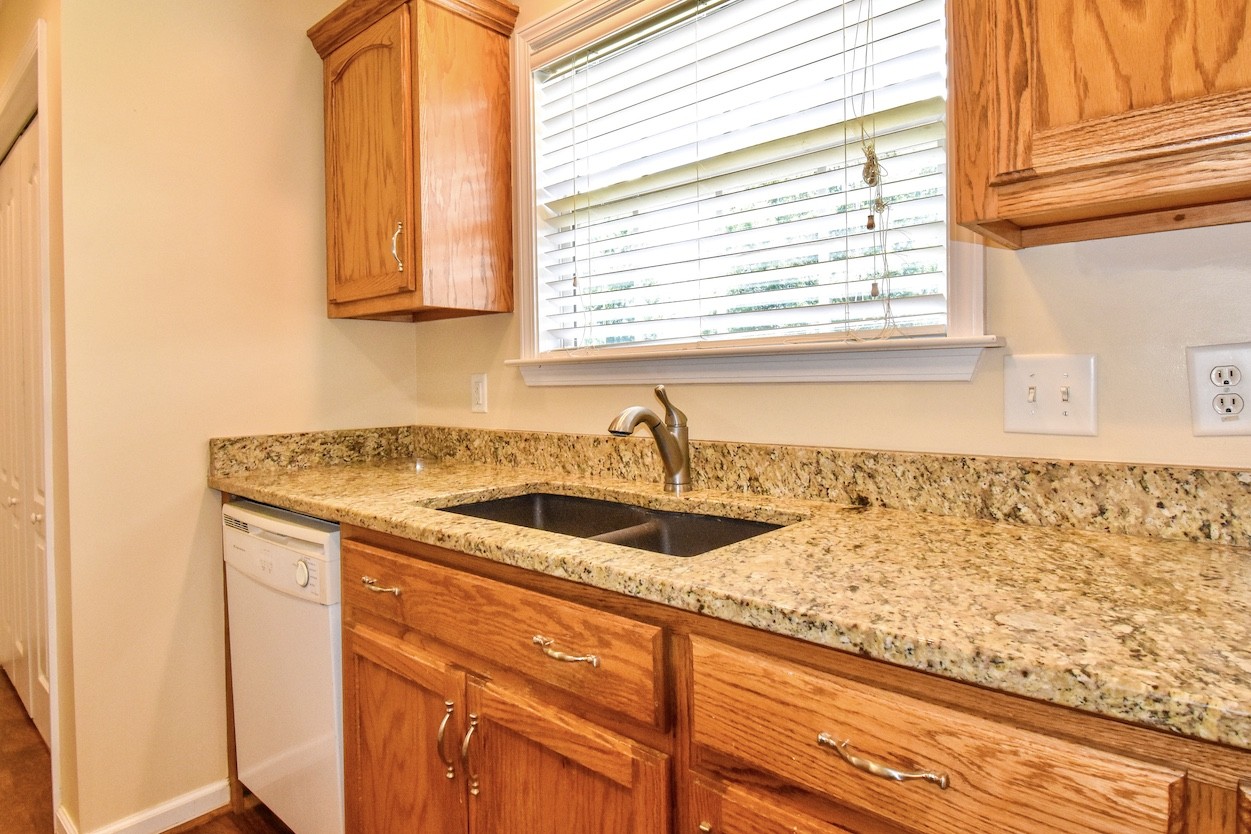 1621 Robert Road Columbia, TN 38401 - Photo 12 of 34 a kitchen with granite countertop sink and window