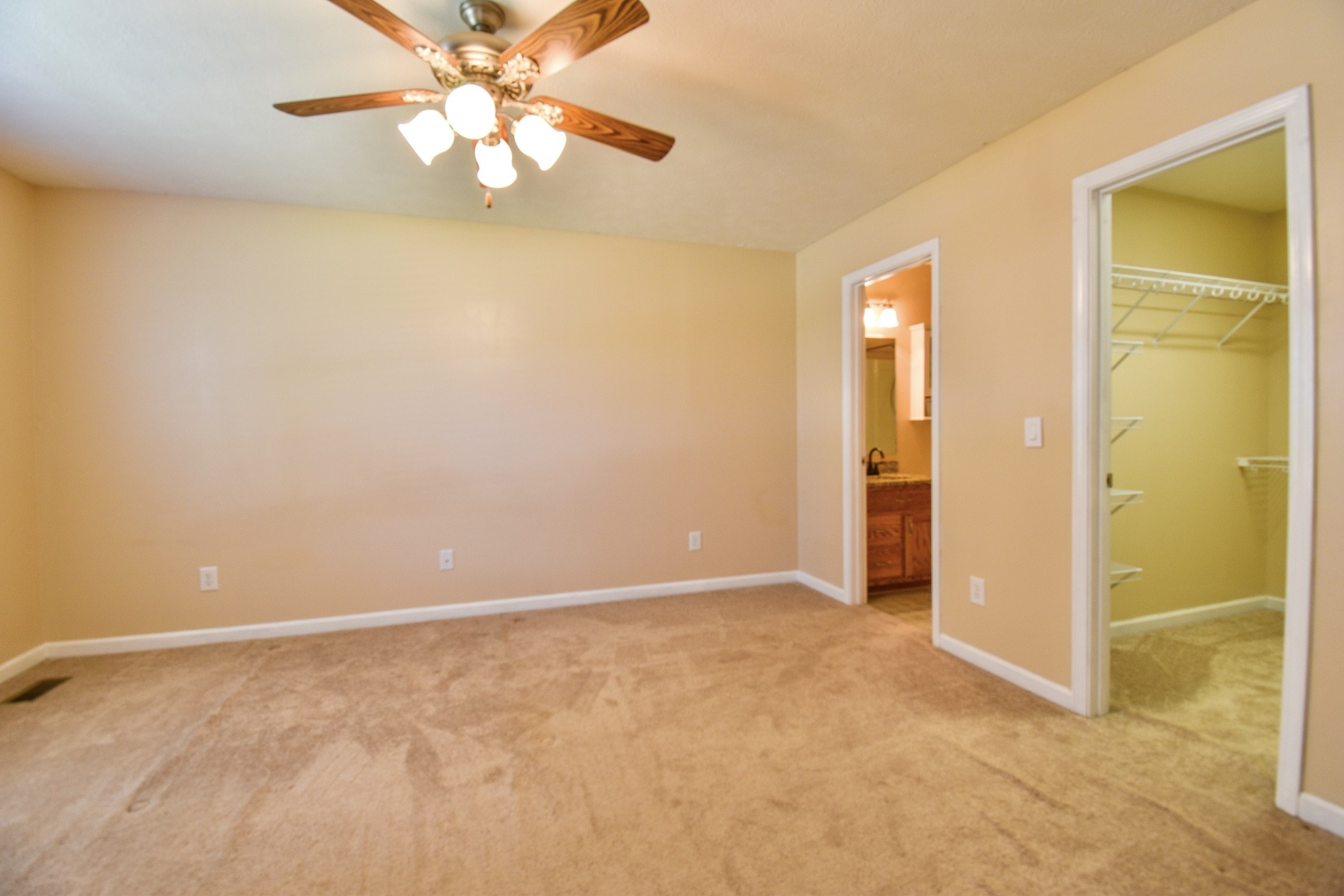 1621 Robert Road Columbia, TN 38401 - Photo 14 of 34 an empty room with closet and a chandelier fan