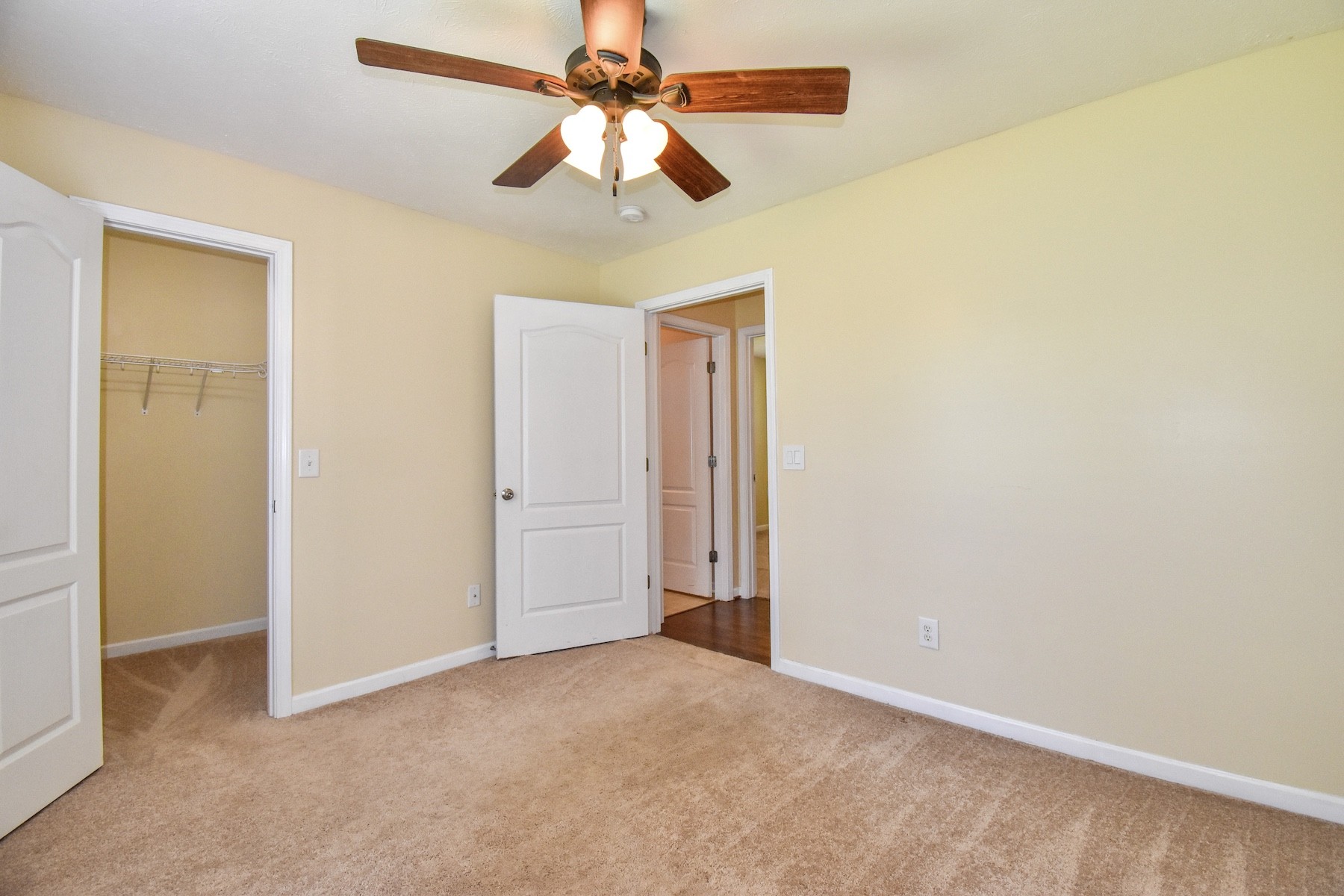 1621 Robert Road Columbia, TN 38401 - Photo 19 of 34 an empty room with a chandelier fan and windows