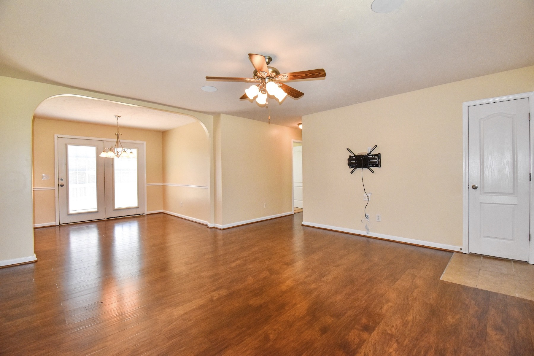 1621 Robert Road Columbia, TN 38401 - Photo 4 of 34 an empty room with wooden floor fan and windows
