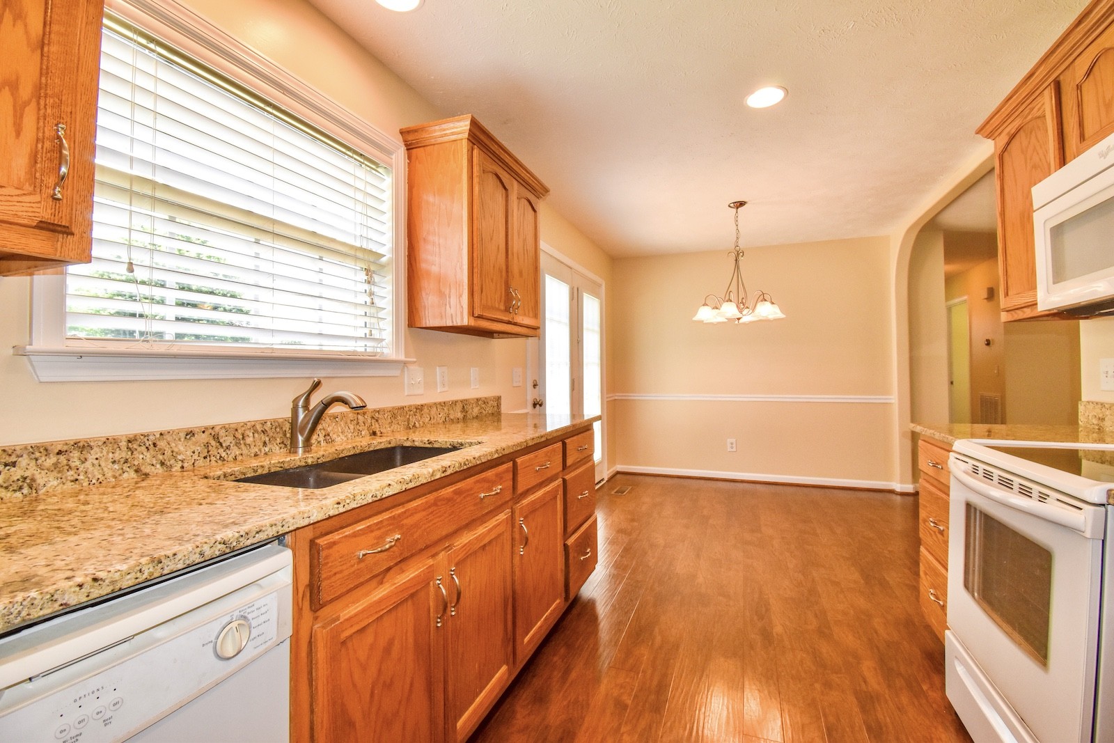 1621 Robert Road Columbia, TN 38401 - Photo 8 of 34 a kitchen with granite countertop a sink a counter space appliances and cabinets