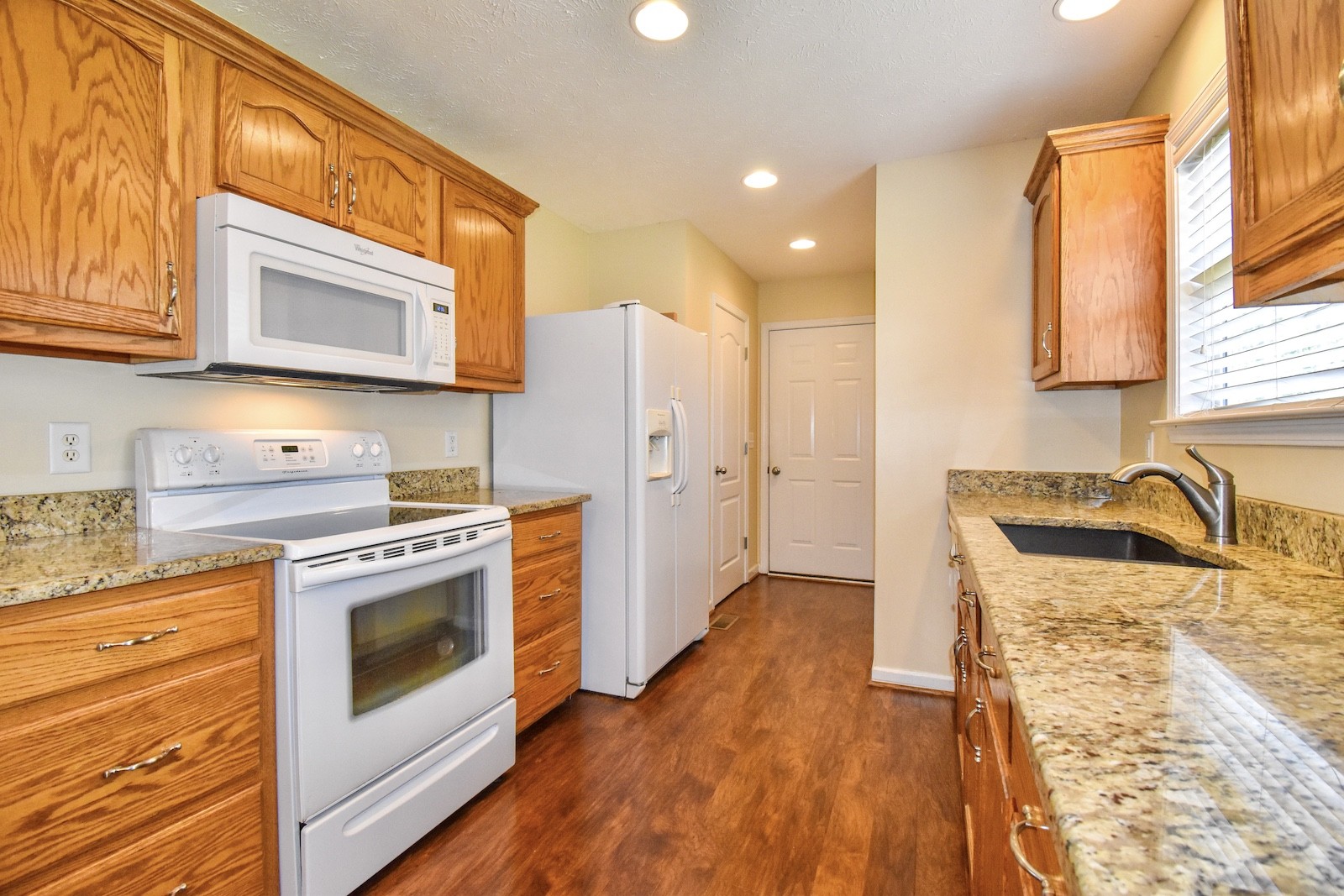 1621 Robert Road Columbia, TN 38401 - Photo 10 of 34 a kitchen with a stove a sink and a refrigerator