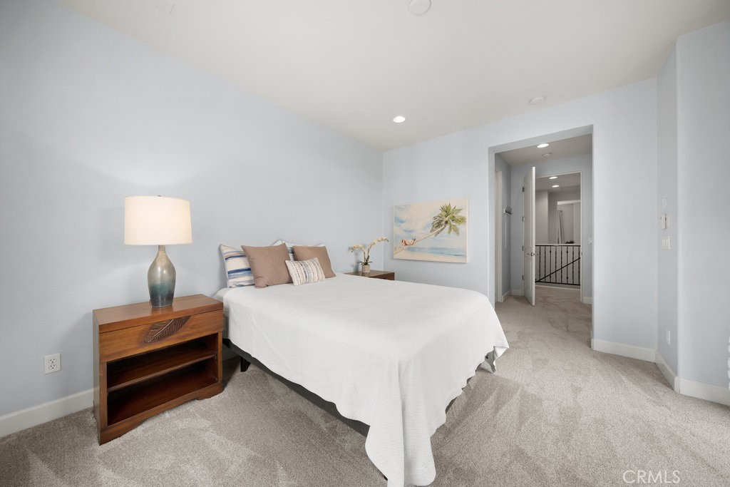 1156 Spring Azure Way Nipomo, CA 93444 - Photo 19 of 60 a bedroom with a bed and a lamp