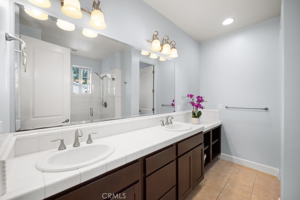 1156 Spring Azure Way Nipomo, CA 93444 - Photo 20 of 60 a bathroom with a sink double vanity and a mirror