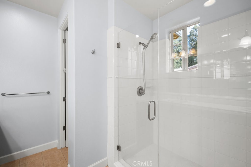 1156 Spring Azure Way Nipomo, CA 93444 - Photo 21 of 60 a bathroom with a shower and a glass door