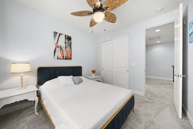 a view of a room with furniture and a window