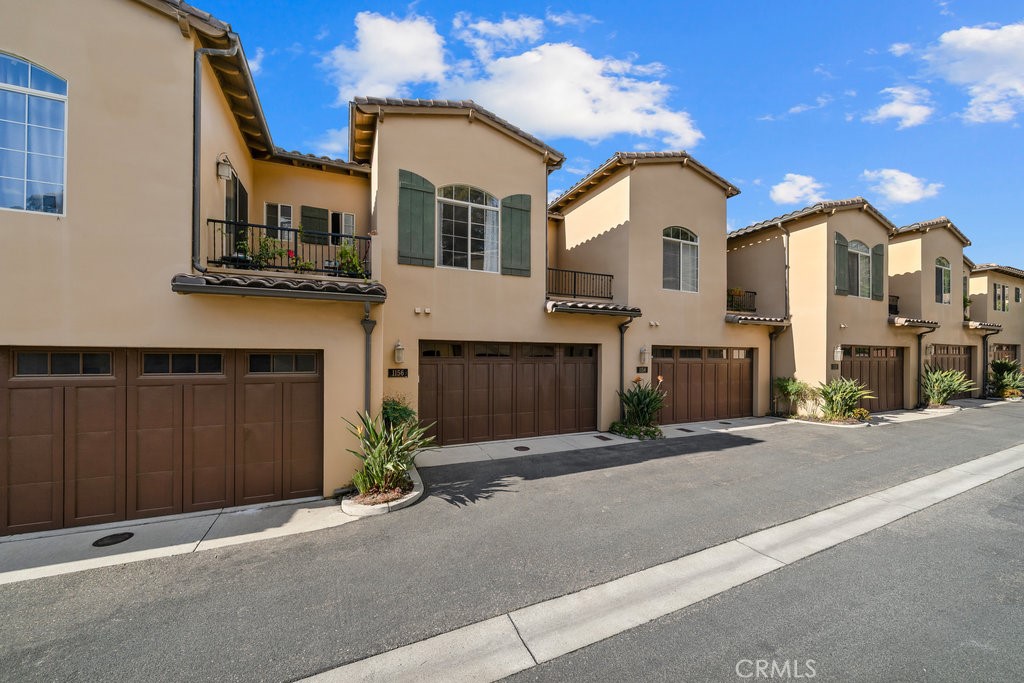 1156 Spring Azure Way Nipomo, CA 93444 - Photo 32 of 60 a view of a large building with a street