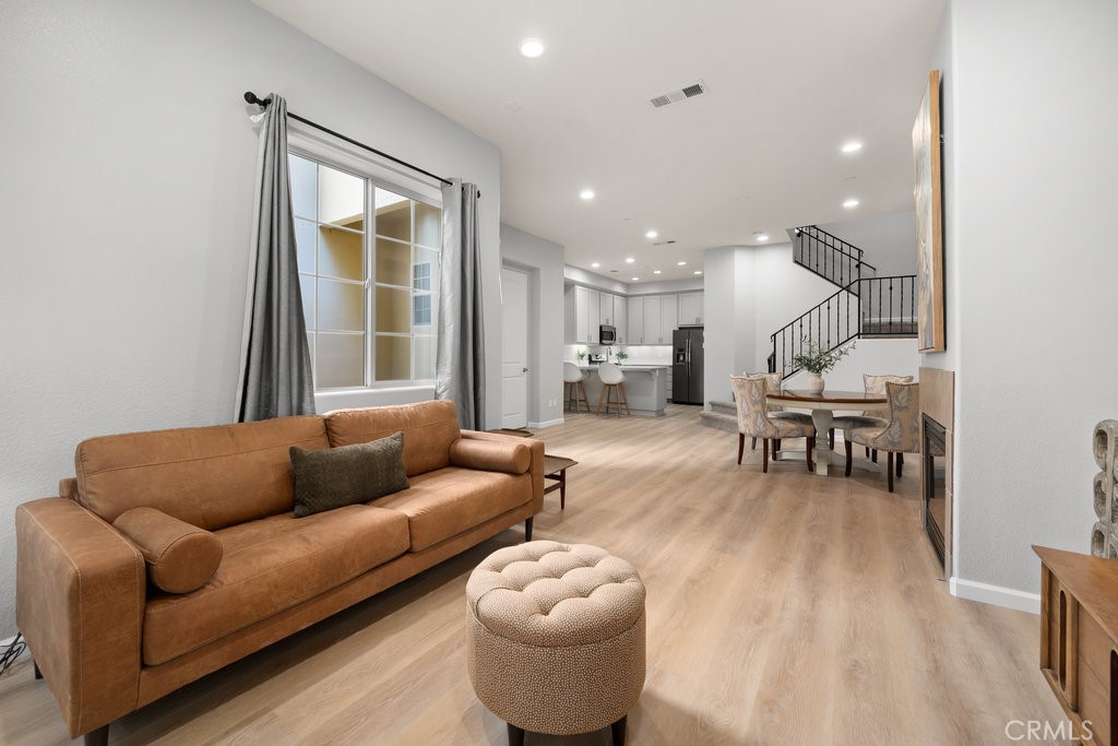 1156 Spring Azure Way Nipomo, CA 93444 - Photo 4 of 60 a living room with furniture and wooden floor