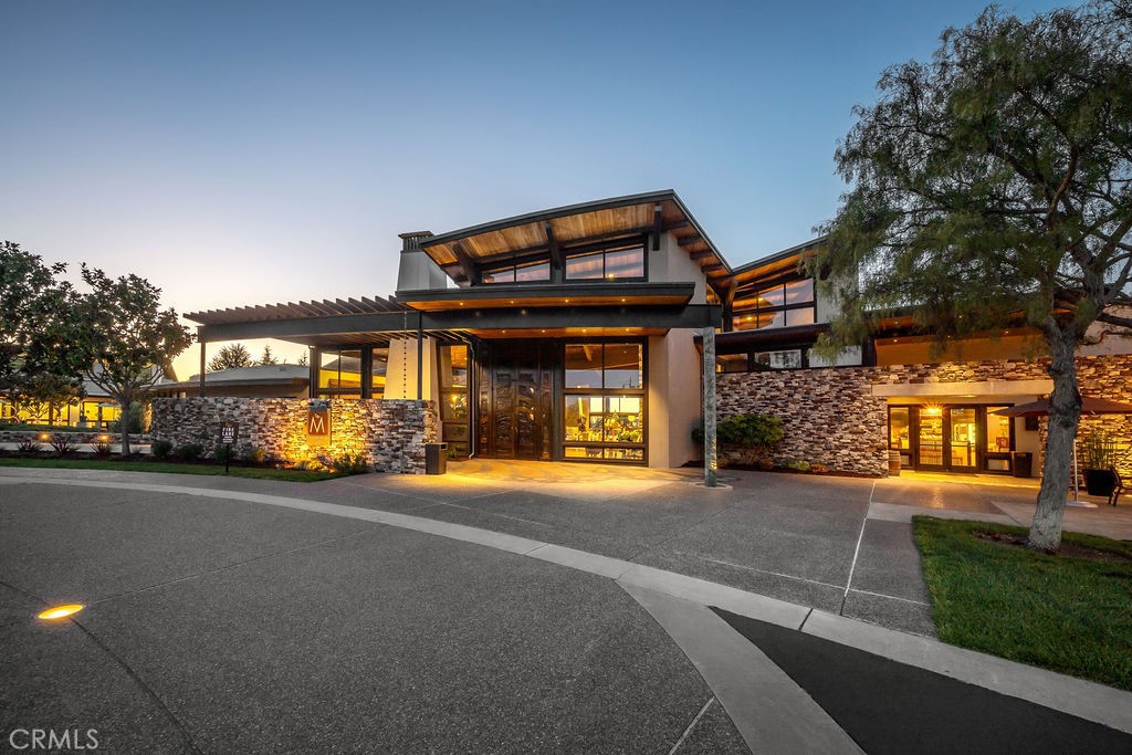 1156 Spring Azure Way Nipomo, CA 93444 - Photo 44 of 60 a front view of a house with a yard and garage