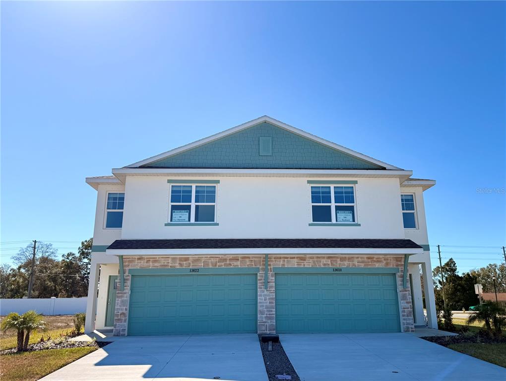 a front view of a house with a garage