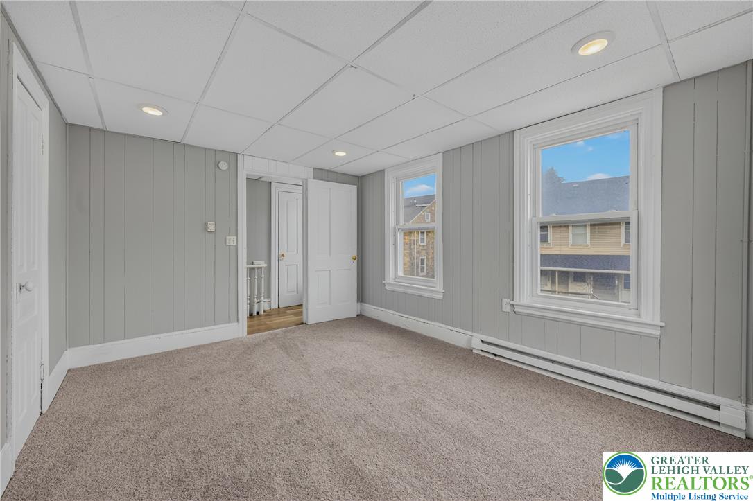 313 Main Street Slatington, PA 18080 - Photo 40 of 73 A comfortable bedroom with ample natural light, soft carpeting, and recessed lighting.