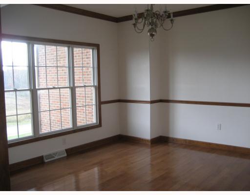 1016 Rowe Road Harrison City, PA 15636 - Photo 5 of 18 Dining Room. Formal Dining room has chair rail crown mold and Hardwood floor