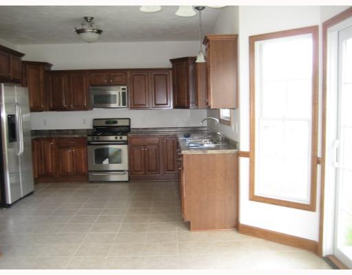 1016 Rowe Road Harrison City, PA 15636 - Photo 7 of 18 Kitchen. This Kichen has maple cabinets with cherry stain and all stainless appliances.