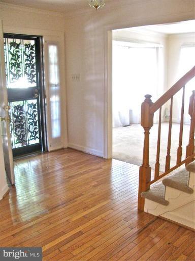 9415 Bluefield Road Springdale, MD 20721 - Photo 3 of 11 Foyer with nice hardwood floors.