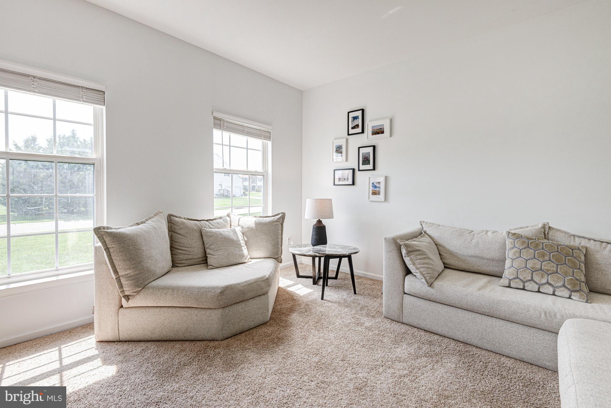 11 Basalt Street Townsend, DE 19734 - Photo 15 of 65 a living room with furniture and a large window