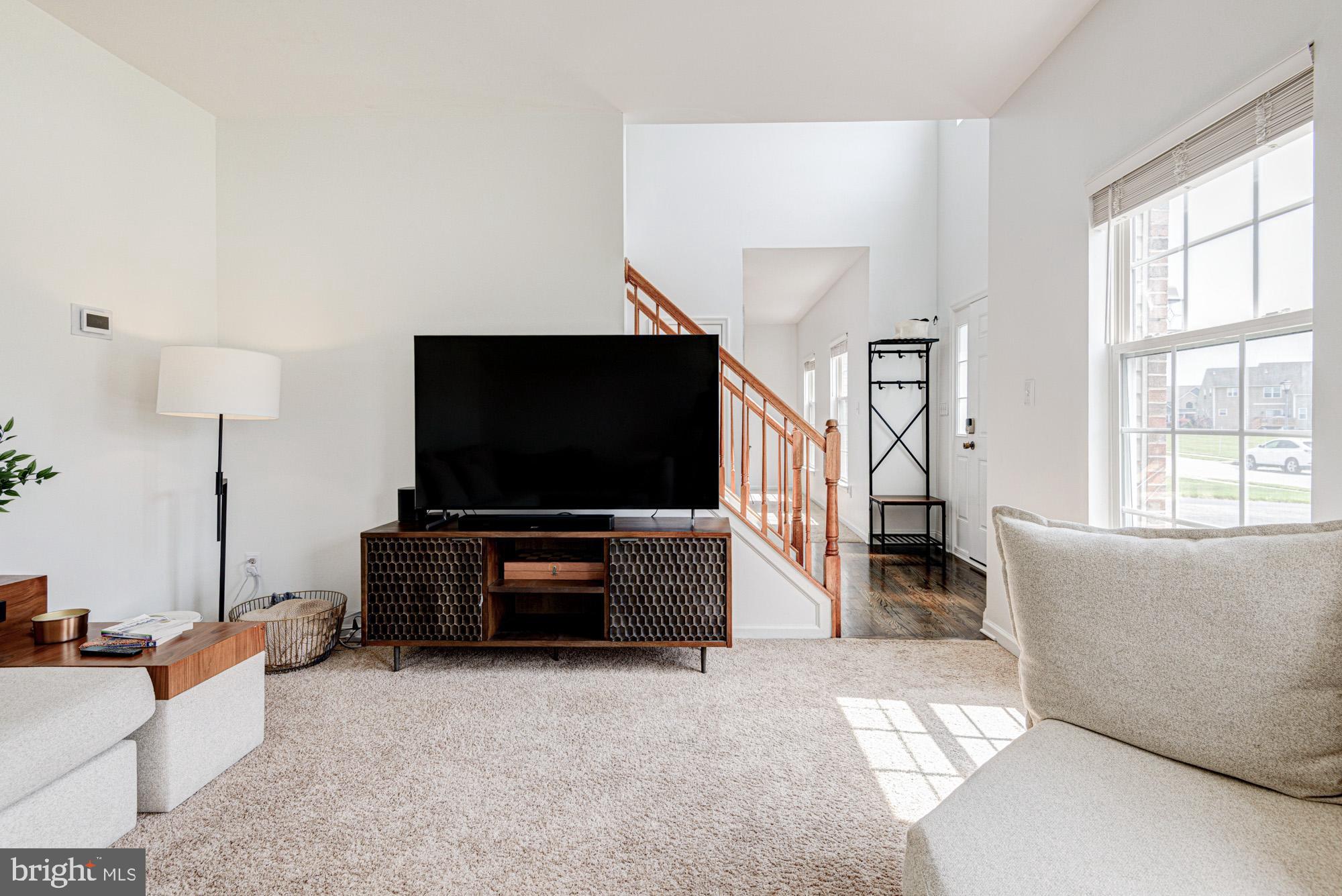 11 Basalt Street Townsend, DE 19734 - Photo 16 of 65 a living room with furniture and a flat screen tv