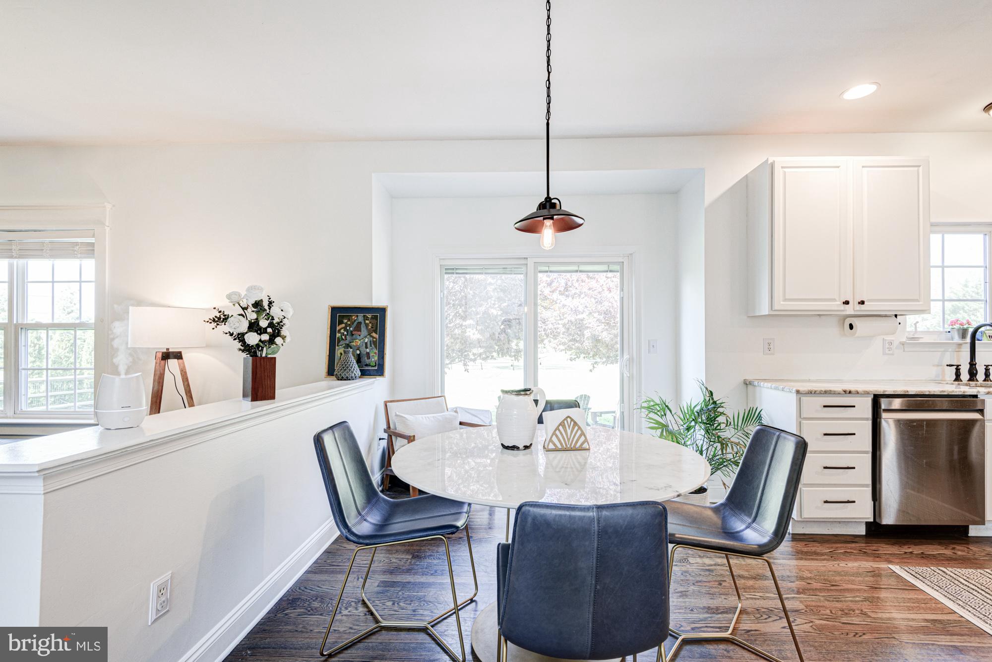 11 Basalt Street Townsend, DE 19734 - Photo 27 of 65 a dining room with furniture a chandelier and wooden floor