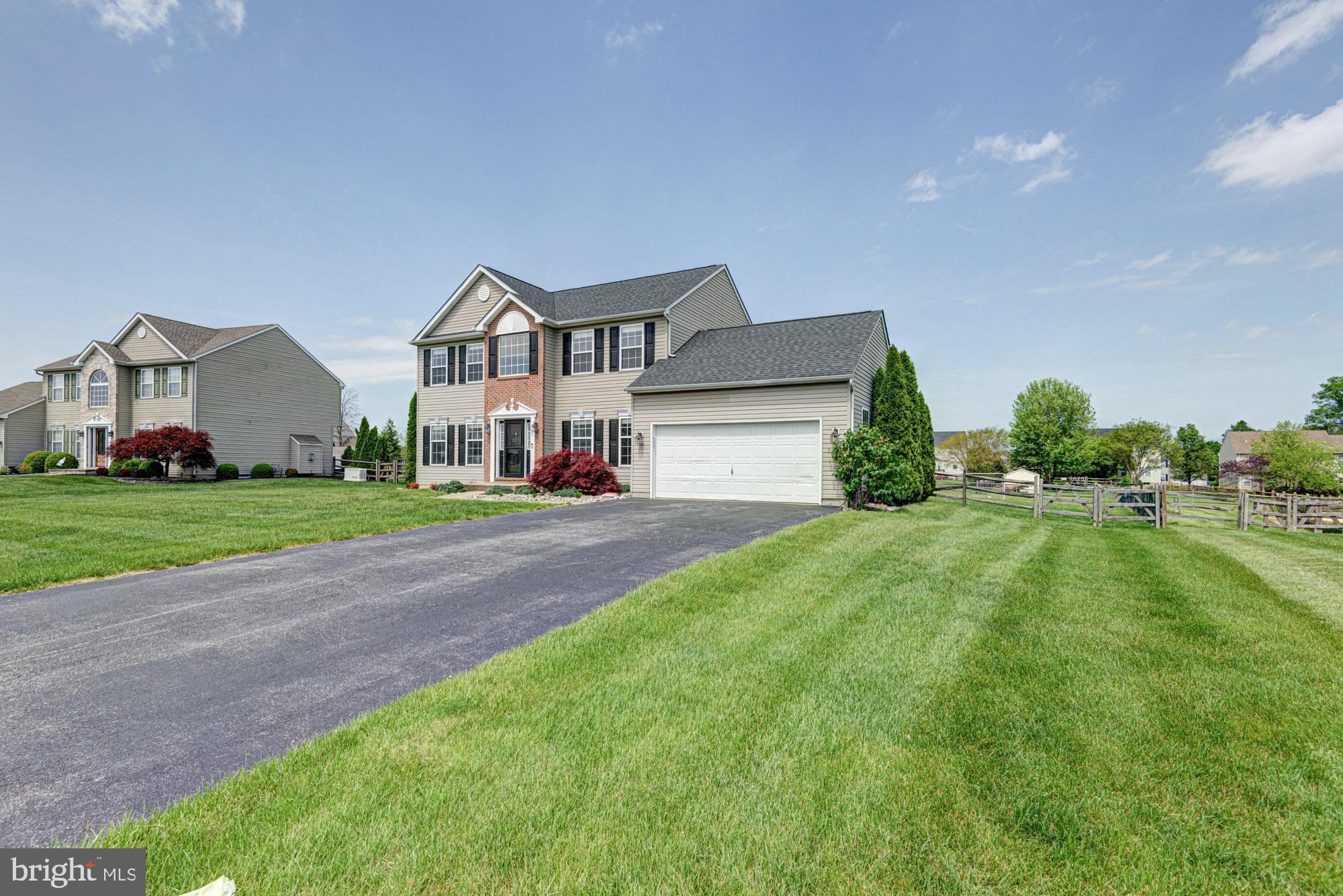 11 Basalt Street Townsend, DE 19734 - Photo 3 of 65 a front view of a house with a yard and garage
