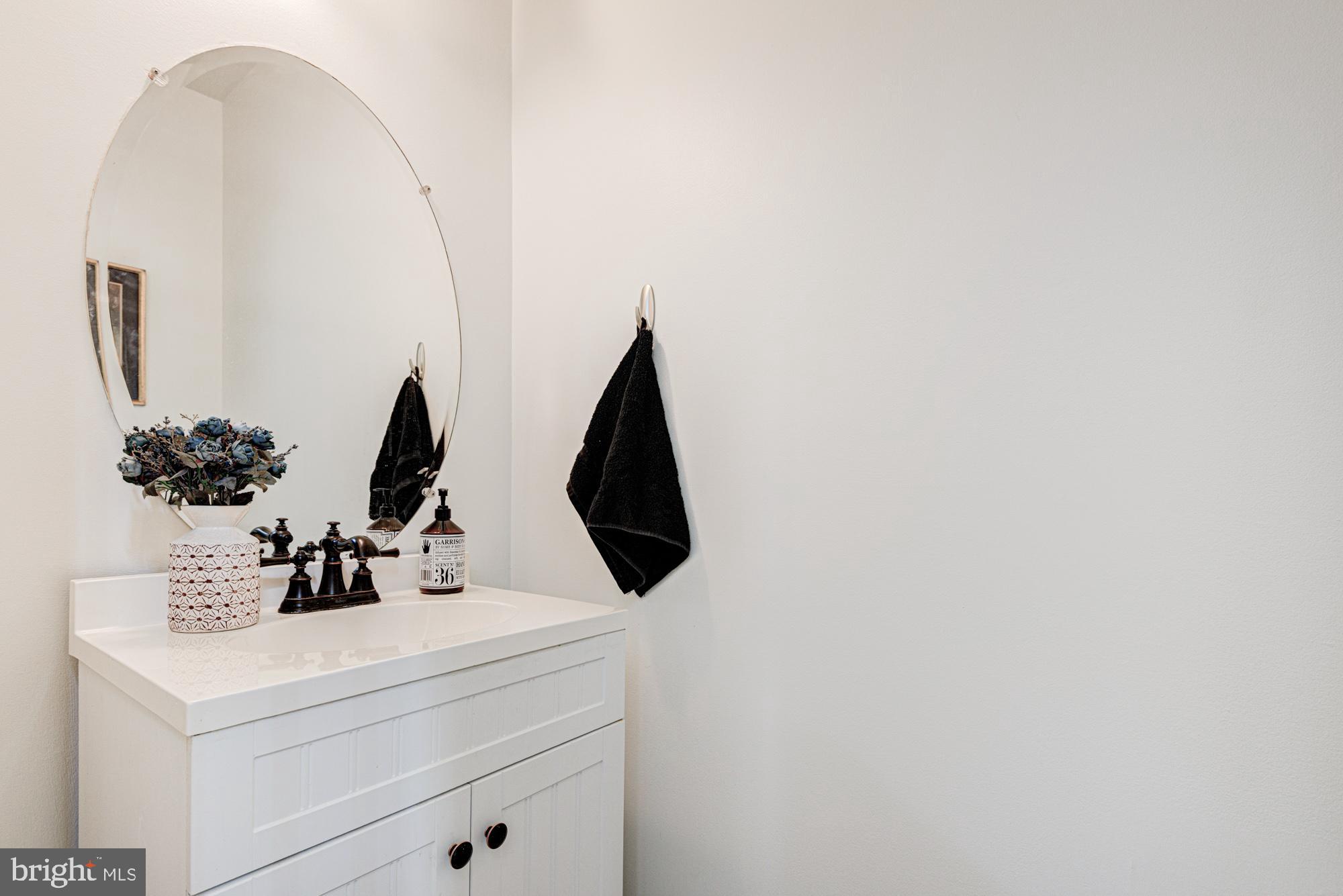 11 Basalt Street Townsend, DE 19734 - Photo 33 of 65 a bathroom with a sink and a mirror