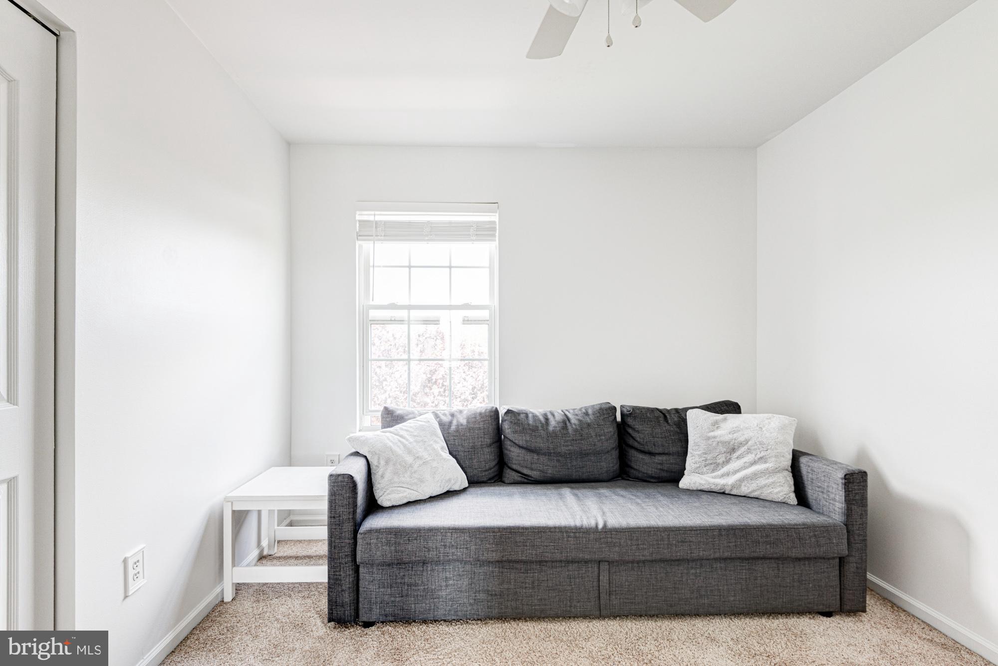 11 Basalt Street Townsend, DE 19734 - Photo 41 of 65 a living room with furniture and a window