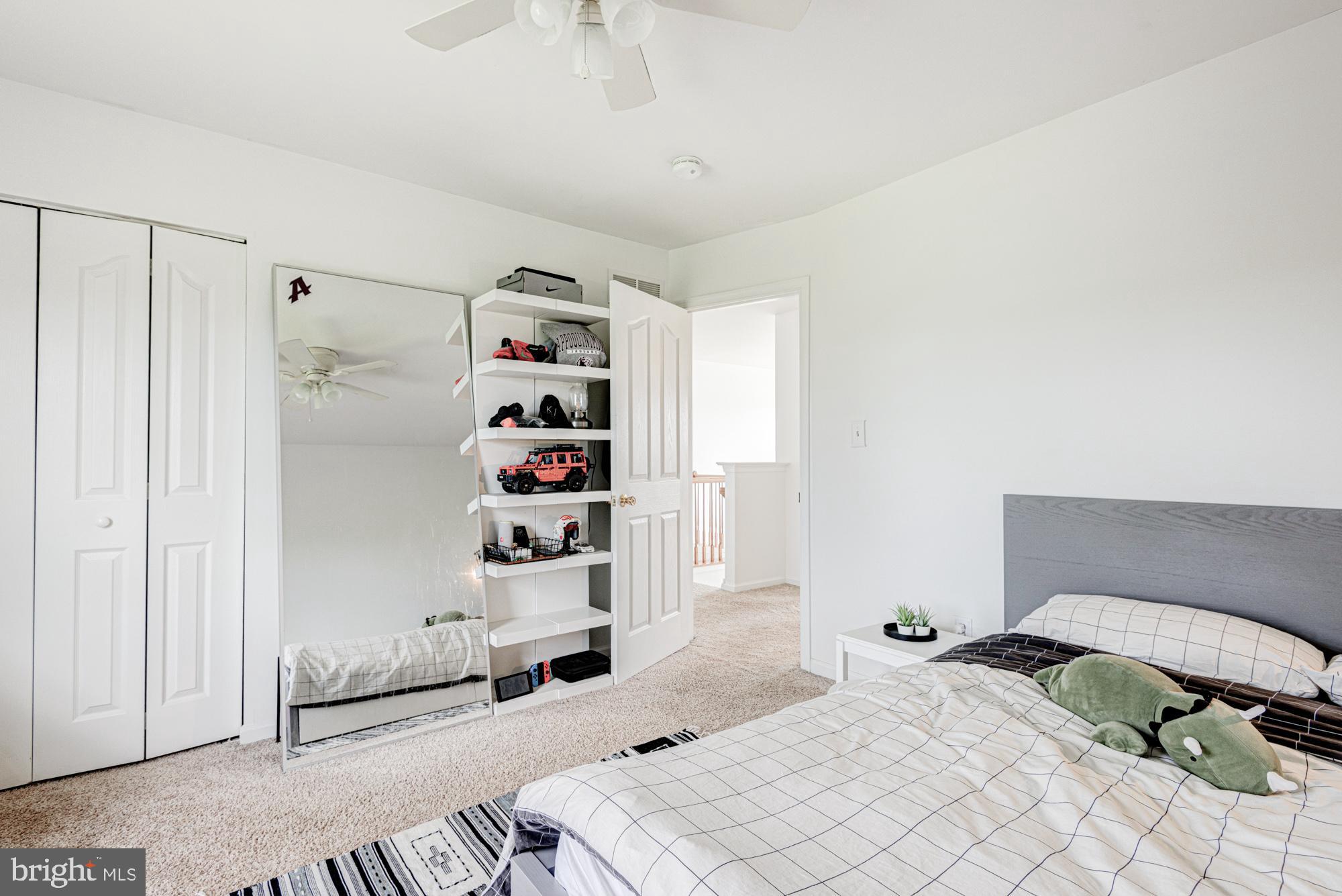 11 Basalt Street Townsend, DE 19734 - Photo 44 of 65 a bedroom with a bed and cabinets