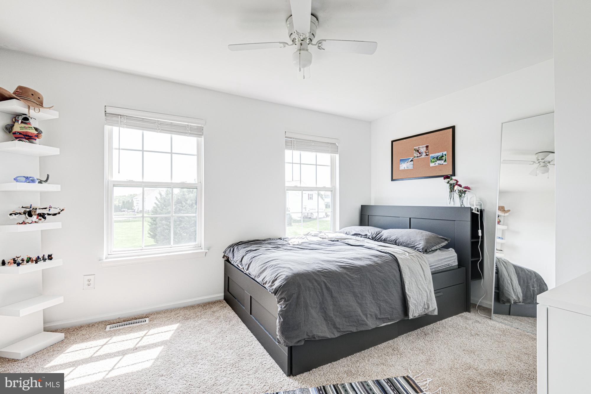 11 Basalt Street Townsend, DE 19734 - Photo 47 of 65 a bedroom with a bed painting on wall and a window