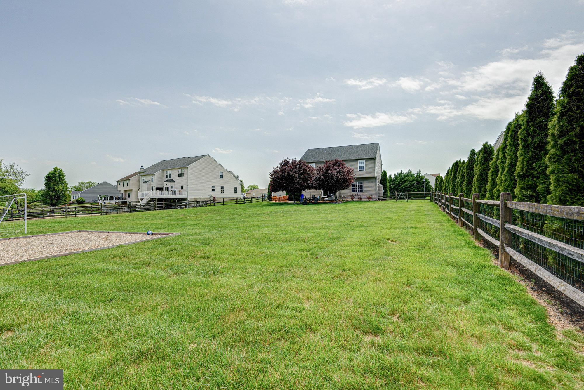 11 Basalt Street Townsend, DE 19734 - Photo 7 of 65 a view of a green field with house in the background