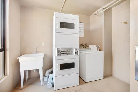 a swimming pool with outdoor seating and yard