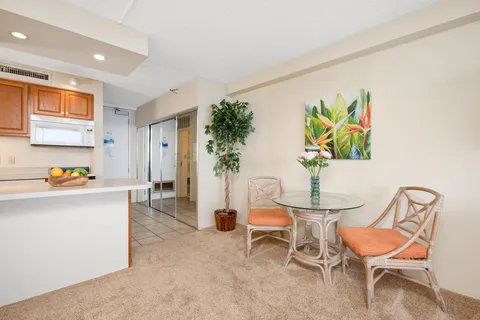 a living room with a sink and a cabinets