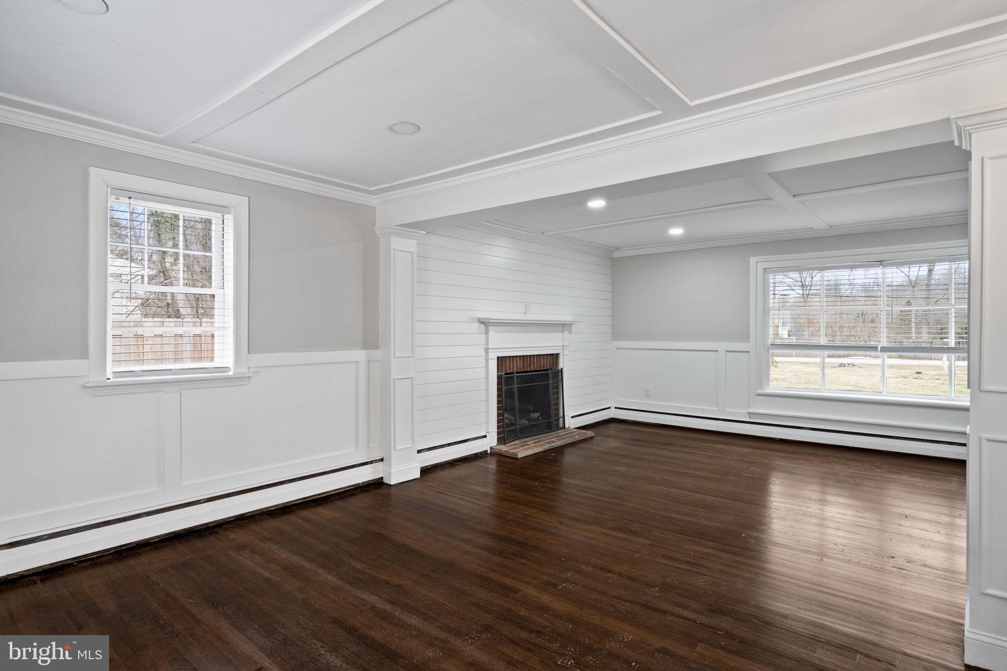 383 Upper Gulph Road Wayne, PA 19087 - Photo 11 of 42 an empty room with wooden floor and windows