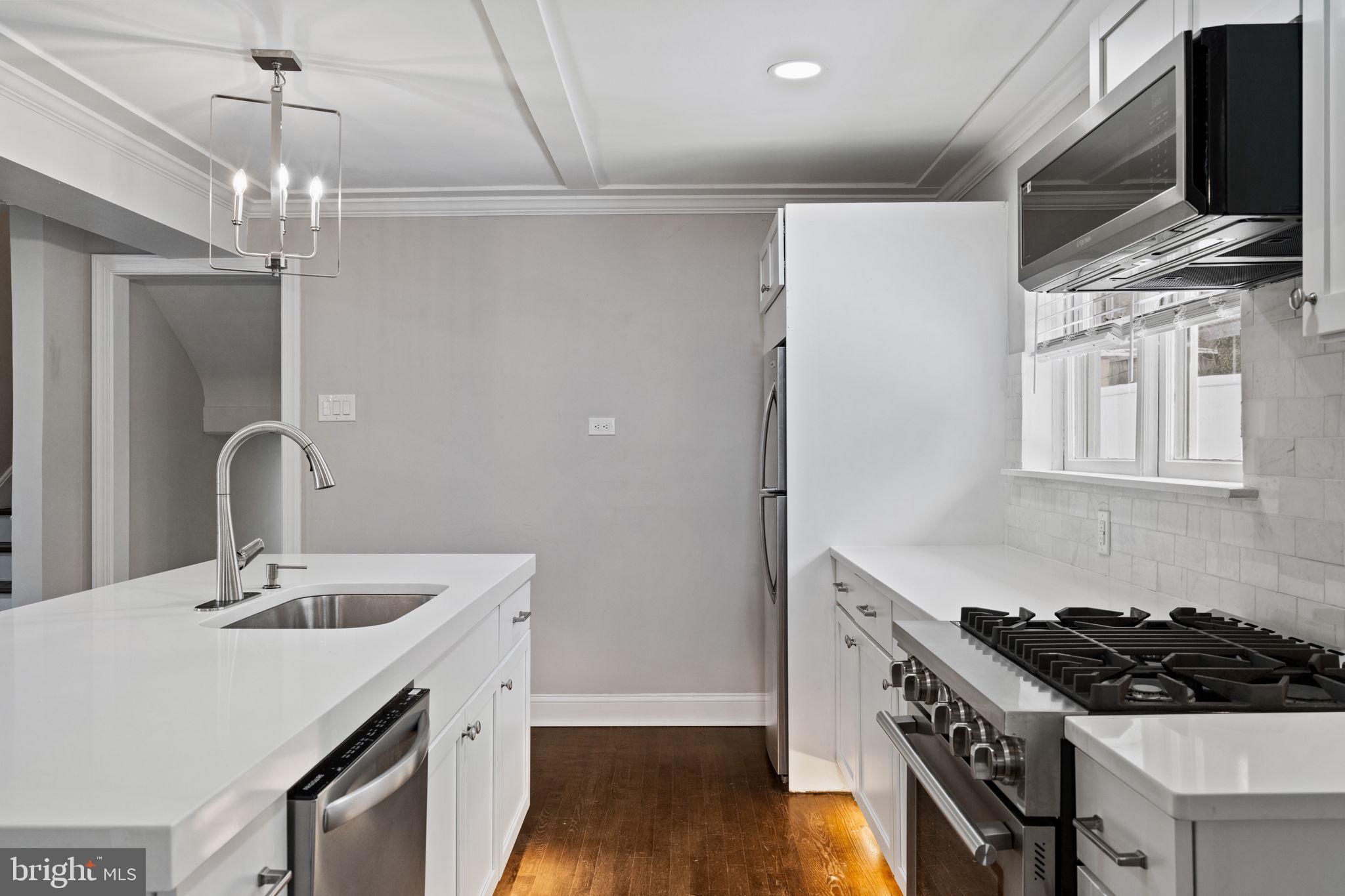 383 Upper Gulph Road Wayne, PA 19087 - Photo 15 of 42 a kitchen with stainless steel appliances granite countertop a sink stove and refrigerator