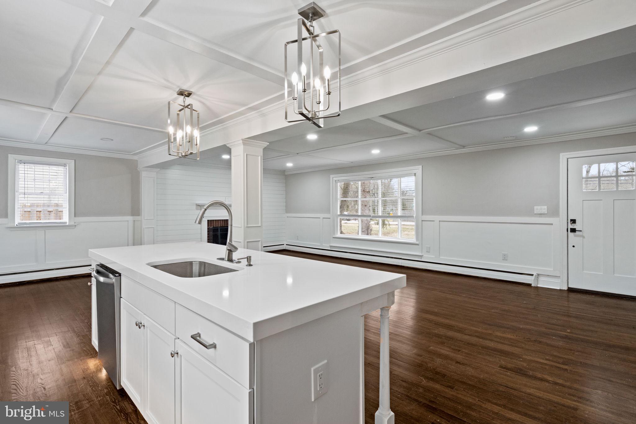 383 Upper Gulph Road Wayne, PA 19087 - Photo 18 of 42 a view of a kitchen island a sink and wooden floor