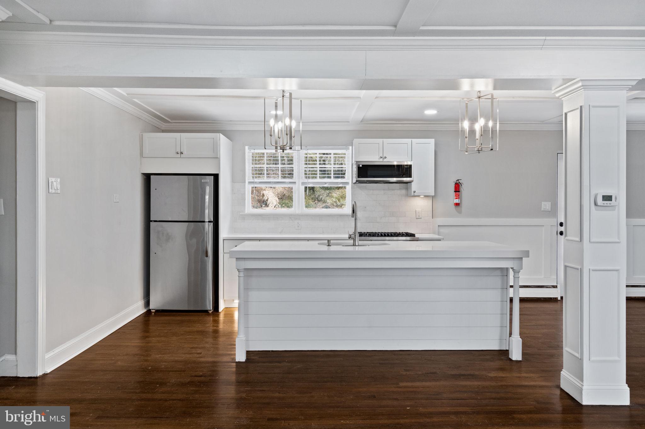 383 Upper Gulph Road Wayne, PA 19087 - Photo 19 of 42 a kitchen with kitchen island stainless steel appliances a sink and refrigerator