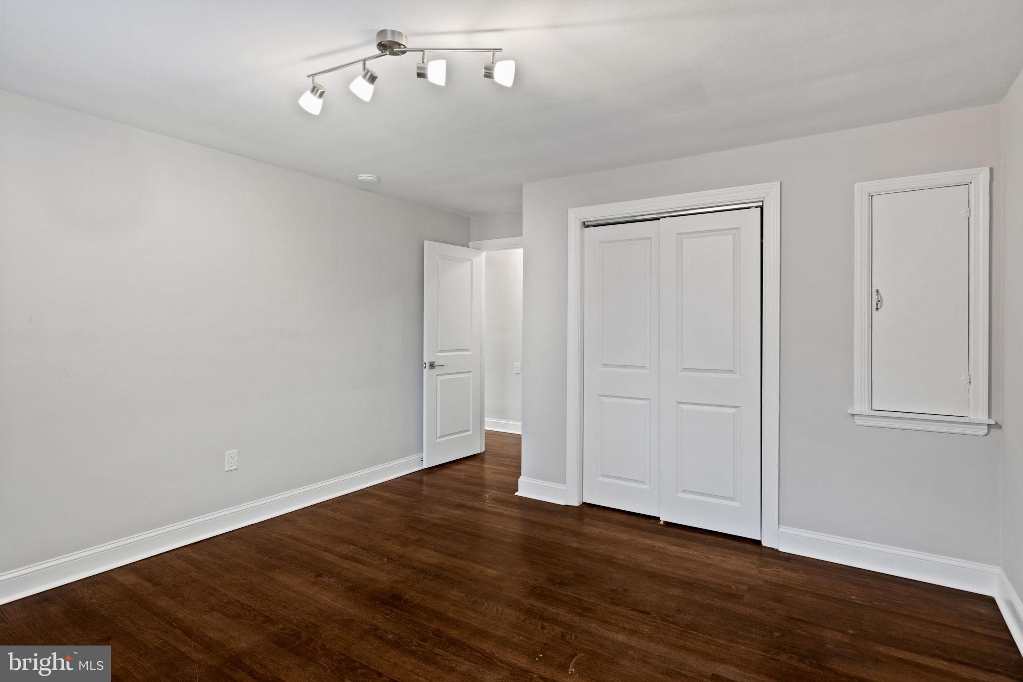 383 Upper Gulph Road Wayne, PA 19087 - Photo 29 of 42 a view of an empty room with wooden floor