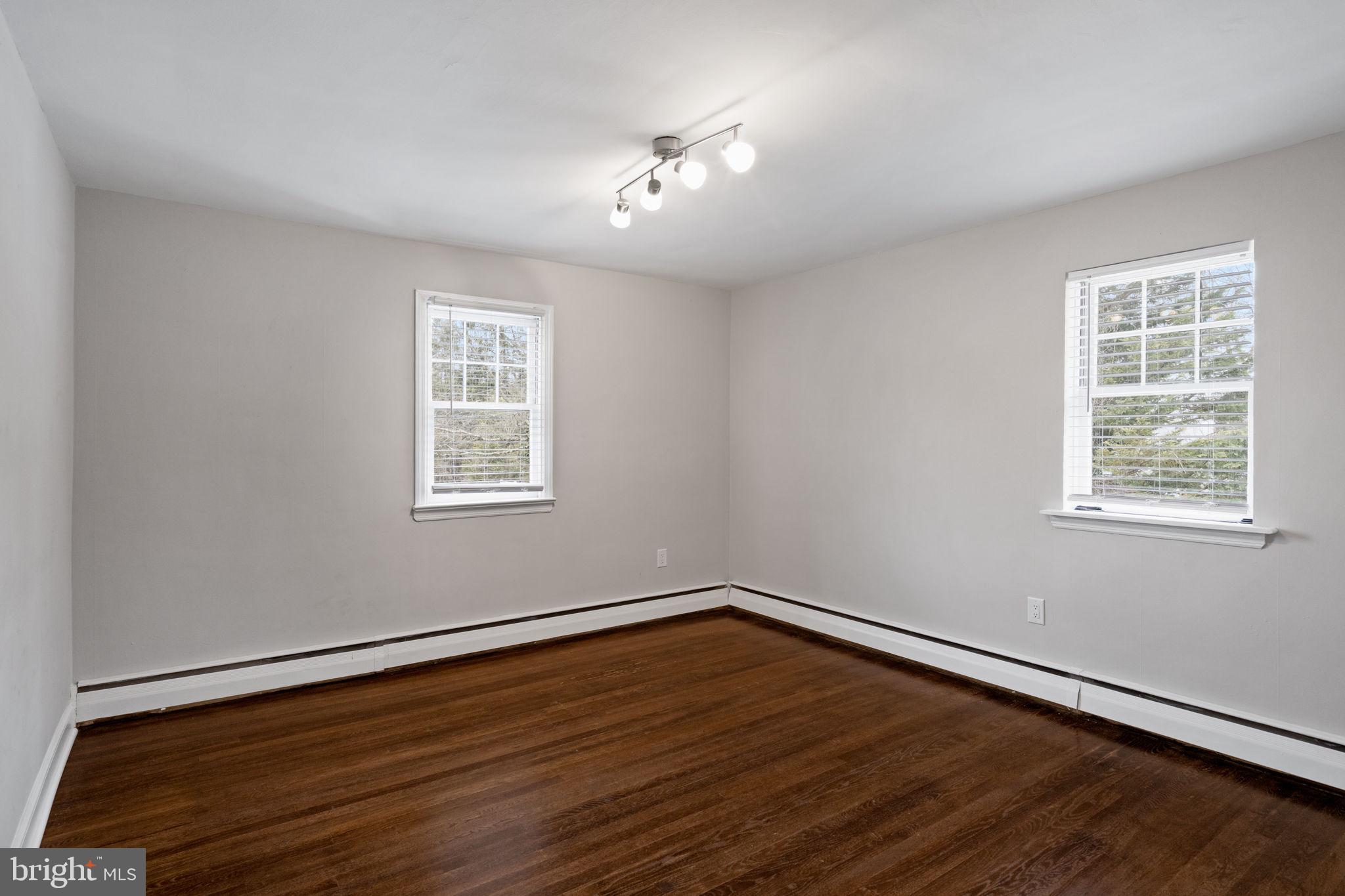 383 Upper Gulph Road Wayne, PA 19087 - Photo 30 of 42 a view of a room with wooden floor and window
