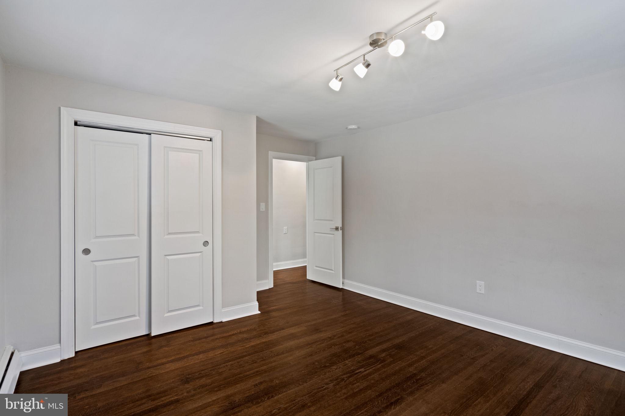 383 Upper Gulph Road Wayne, PA 19087 - Photo 31 of 42 a view of an empty room with wooden floor