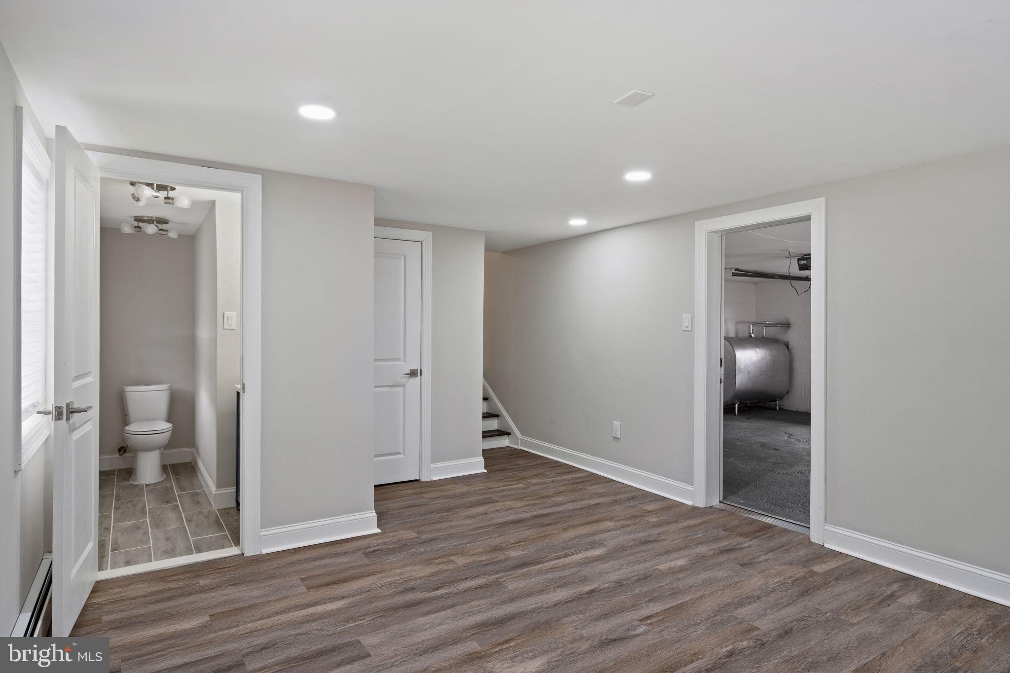 383 Upper Gulph Road Wayne, PA 19087 - Photo 36 of 42 wooden floor in an empty room with a bathroom