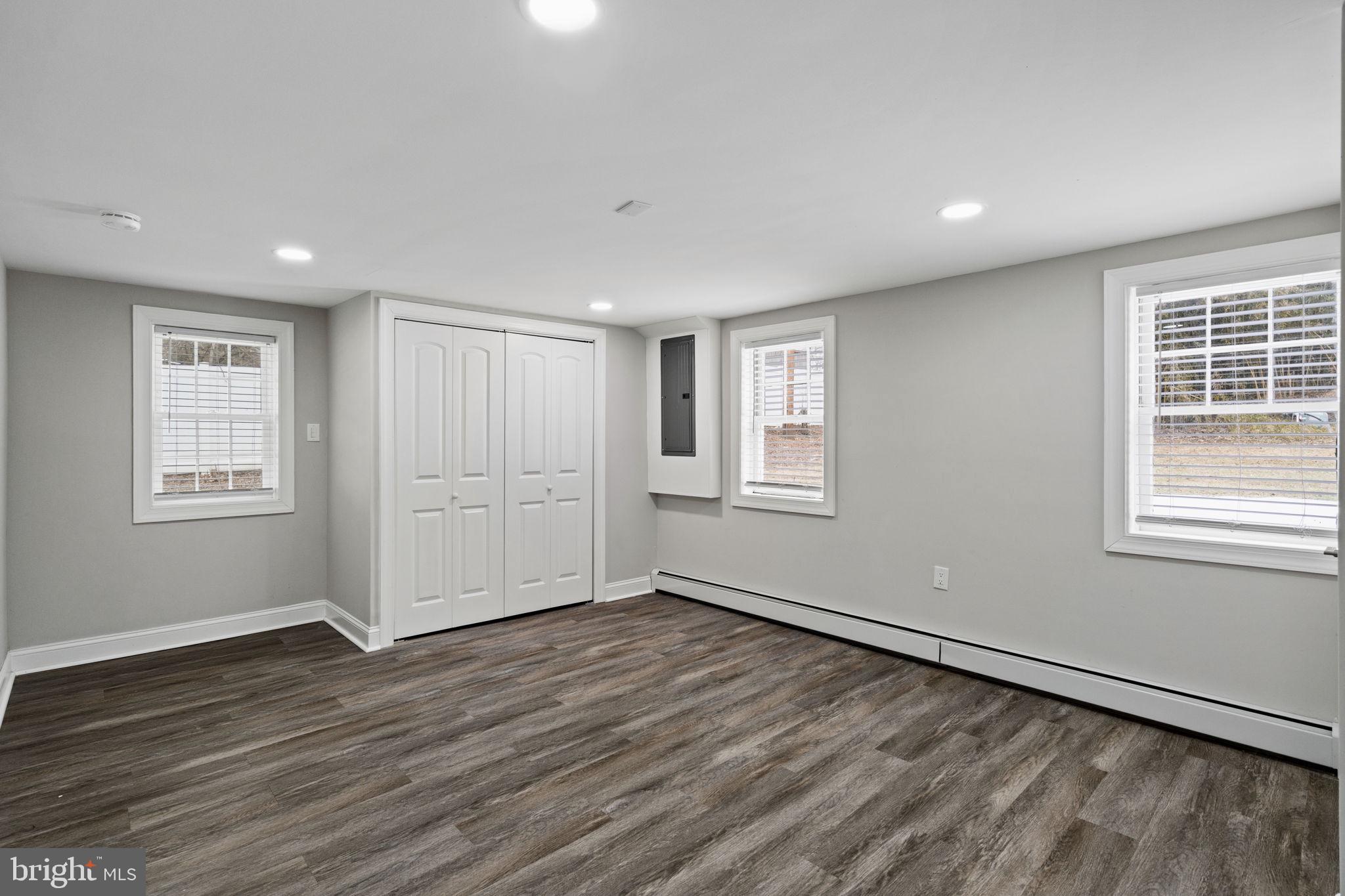 383 Upper Gulph Road Wayne, PA 19087 - Photo 37 of 42 a view of an empty room with wooden floor and a window