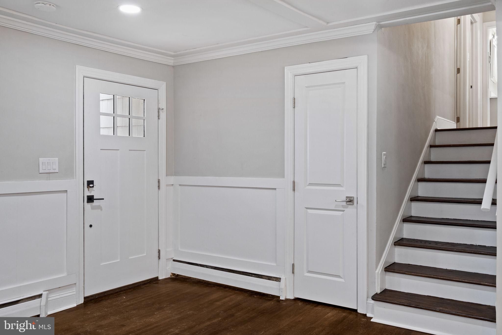 383 Upper Gulph Road Wayne, PA 19087 - Photo 4 of 42 a view of a hallway with wooden floor and entryway