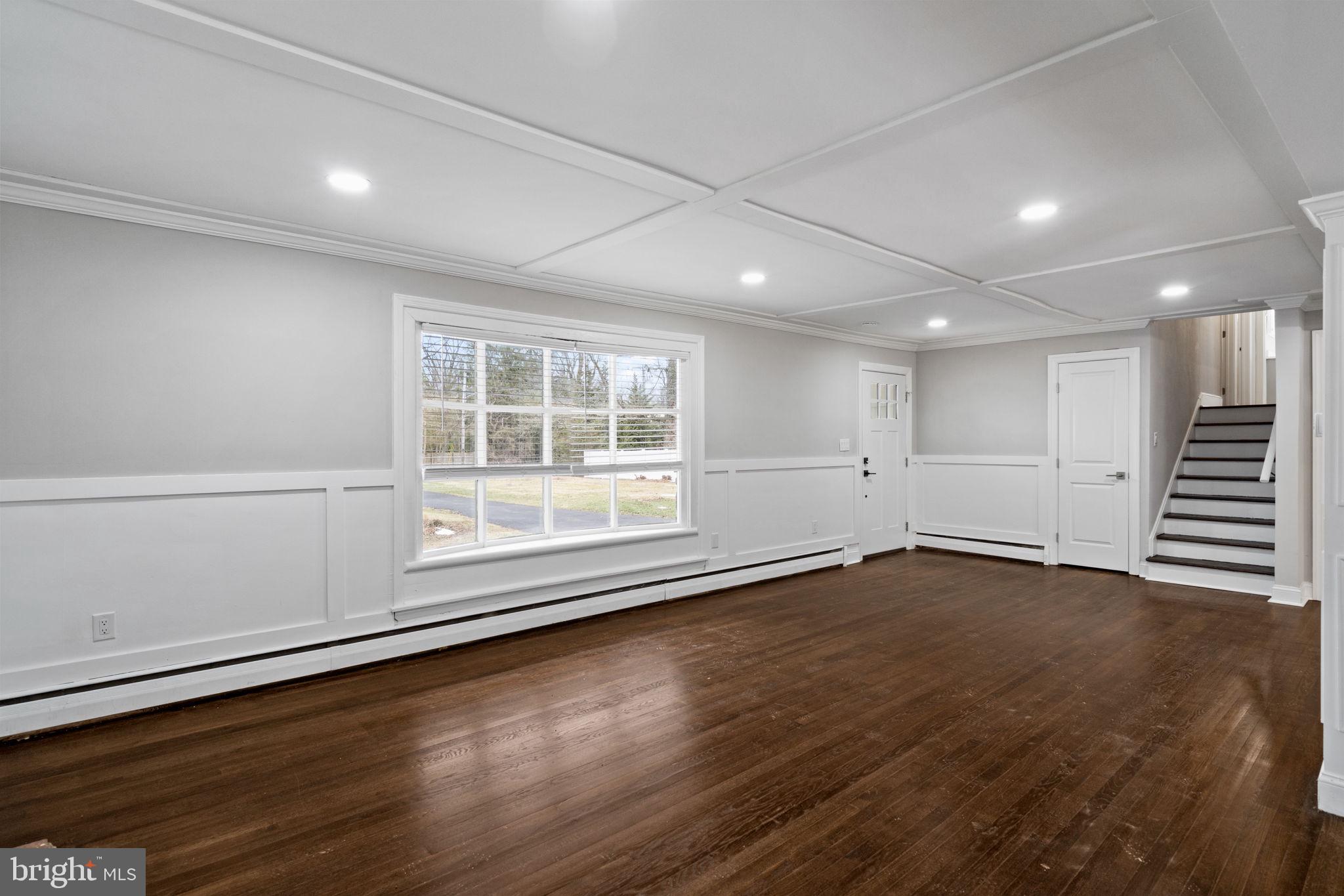 383 Upper Gulph Road Wayne, PA 19087 - Photo 5 of 42 an empty room with wooden floor and windows